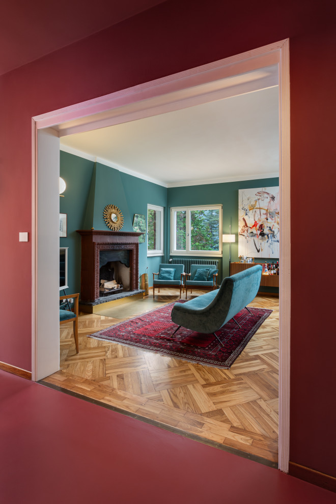 Mid-sized midcentury hallway in Other with red walls, concrete floors and red floor.