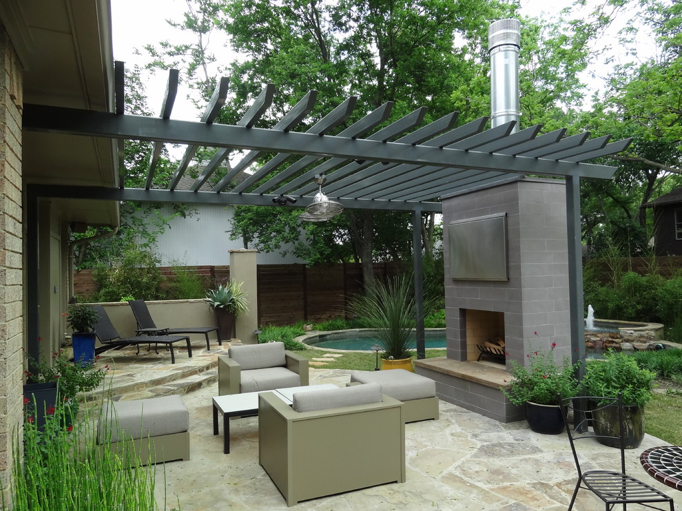 Photo of a contemporary patio in Dallas with a fire feature and a pergola.