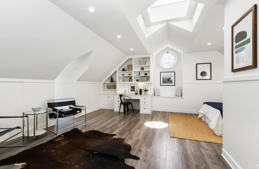Large transitional boy vinyl floor, gray floor, vaulted ceiling and wainscoting kids' room photo in Los Angeles with white walls
