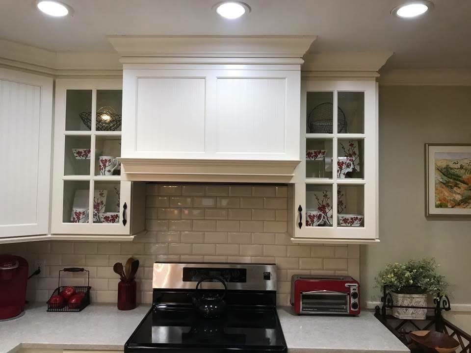 Photo of a transitional u-shaped kitchen in Chicago with an undermount sink, white cabinets, granite benchtops, grey splashback, subway tile splashback, ceramic floors, with island, grey floor and white benchtop.