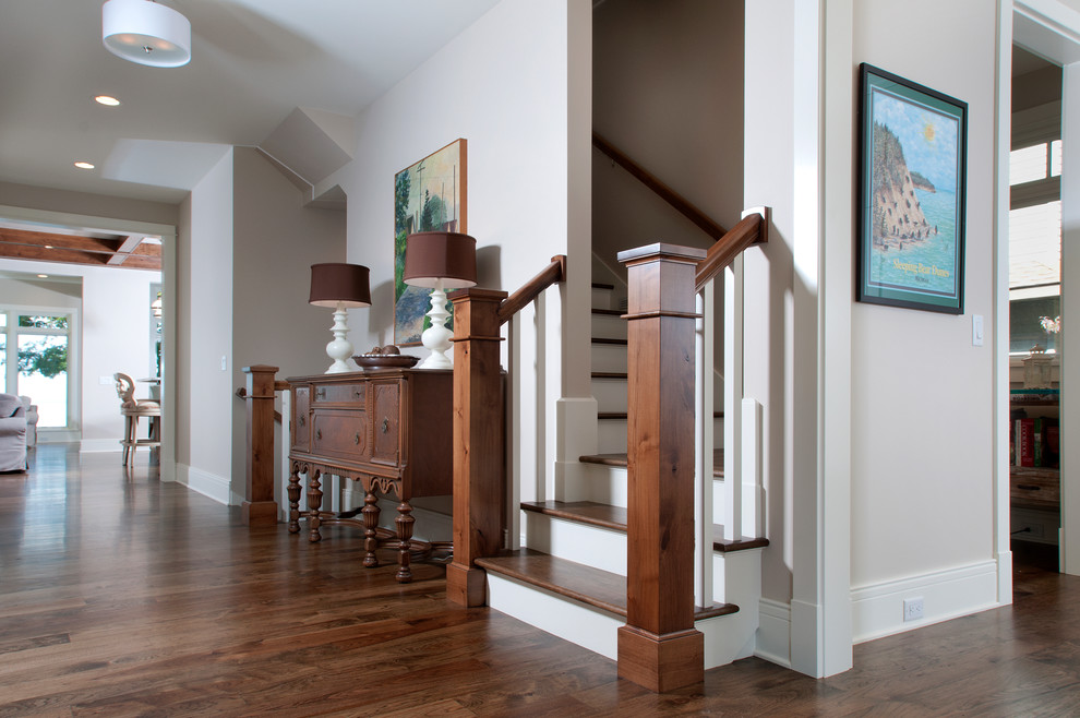 Design ideas for a mid-sized beach style hallway in Grand Rapids with grey walls and medium hardwood floors.