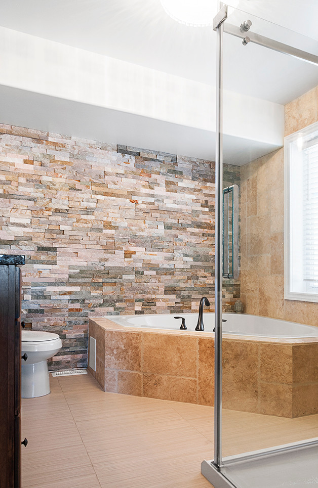 Large contemporary master bathroom in Other with medium wood cabinets, stone tile, porcelain floors, louvered cabinets, a hot tub, a corner shower, a two-piece toilet, brown tile, blue walls, an undermount sink and granite benchtops.