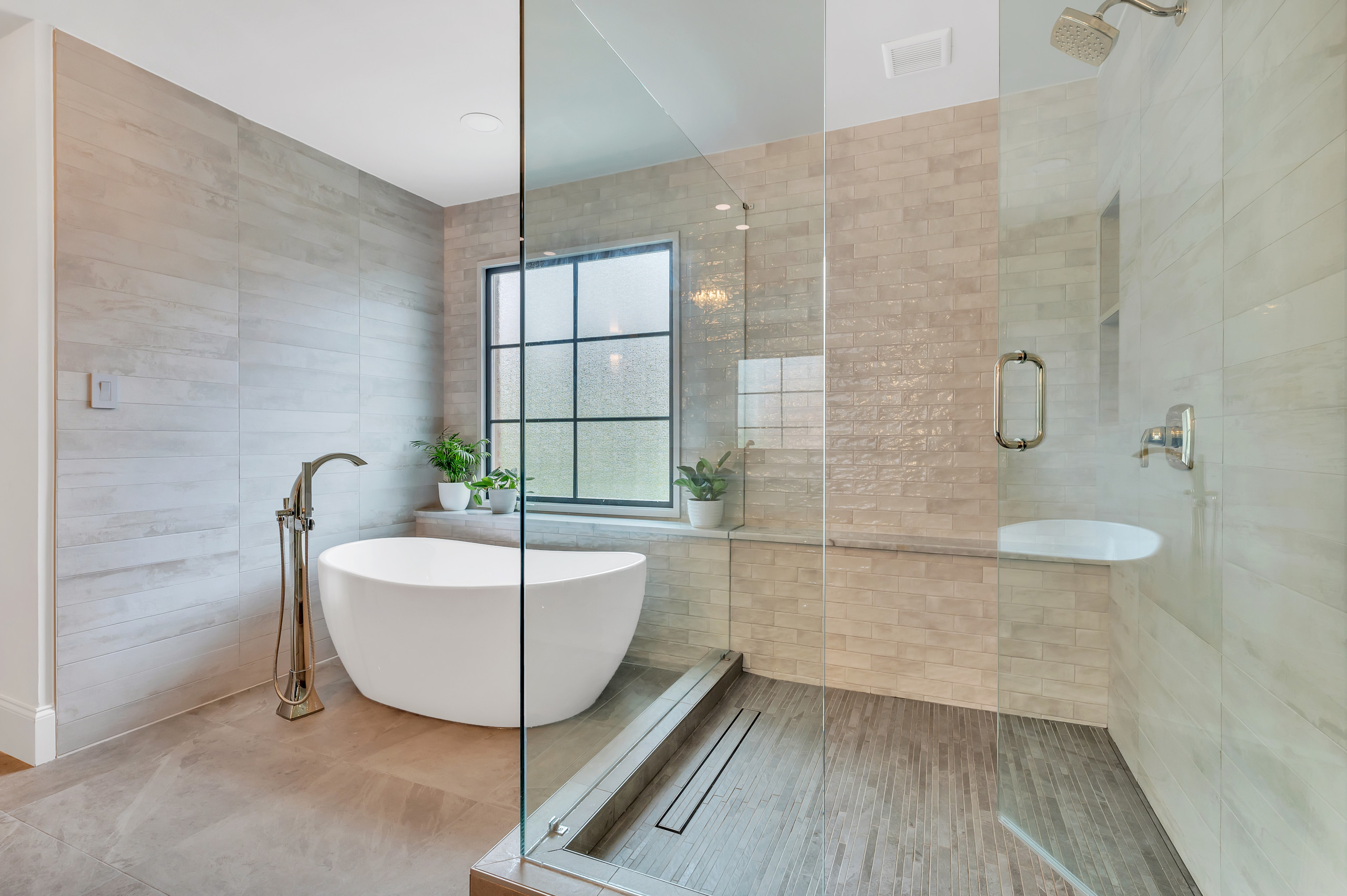 From Builder Grade From the 90’s to a Modern and Sophisticated Spa Feel