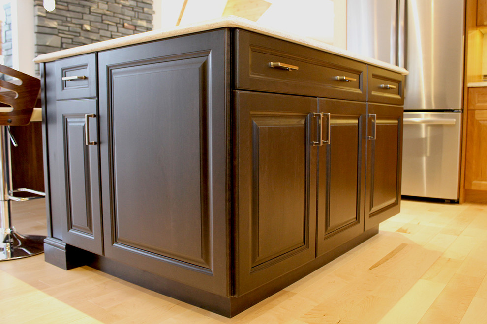 Home design - large transitional u-shaped light wood floor and beige floor home design idea in Boston with an undermount sink, raised-panel cabinets, medium tone wood cabinets, quartz countertops, multicolored backsplash, glass tile backsplash, stainless steel appliances, an island and beige countertops