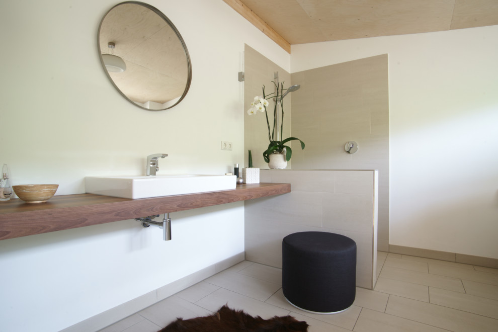 Contemporary bathroom in Other with an open shower, brown benchtops, a single vanity, a floating vanity and wood.