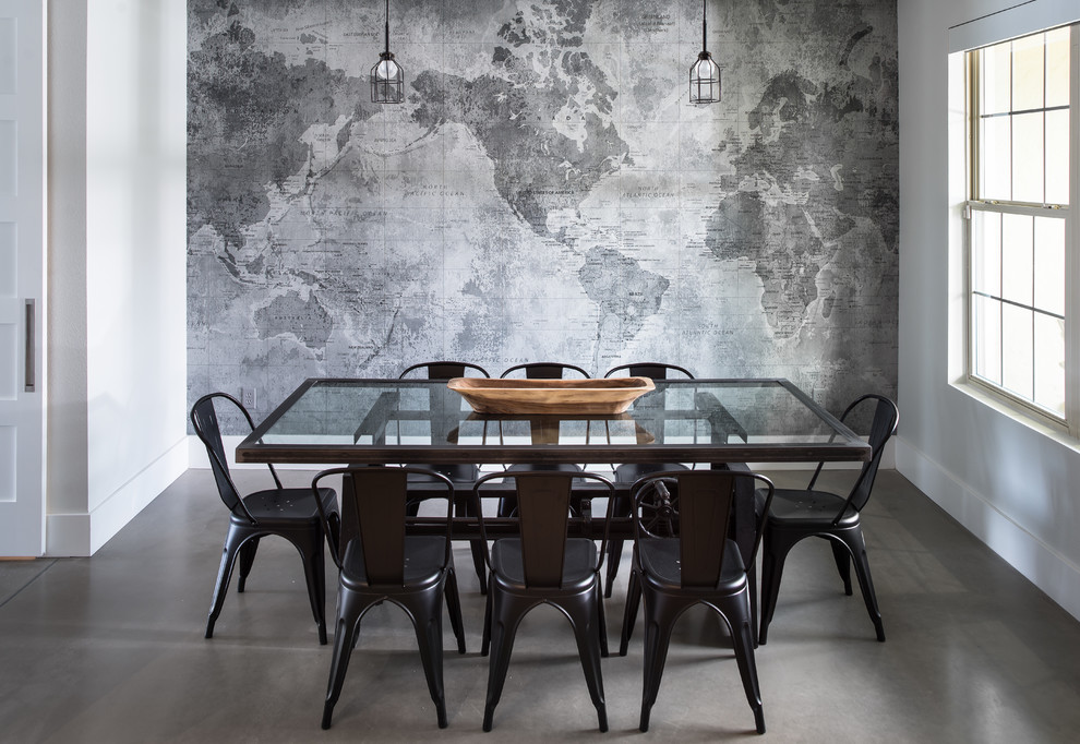 Inspiration for an industrial dining room in Orlando with grey walls, concrete floors and grey floor.