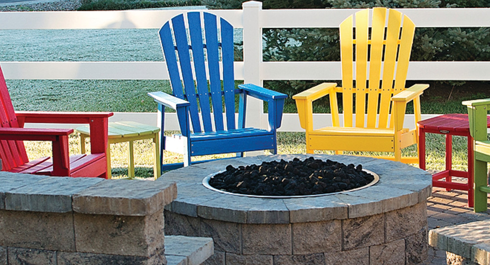 Design ideas for a mid-sized backyard concrete paver landscaping in Denver with a fire pit.