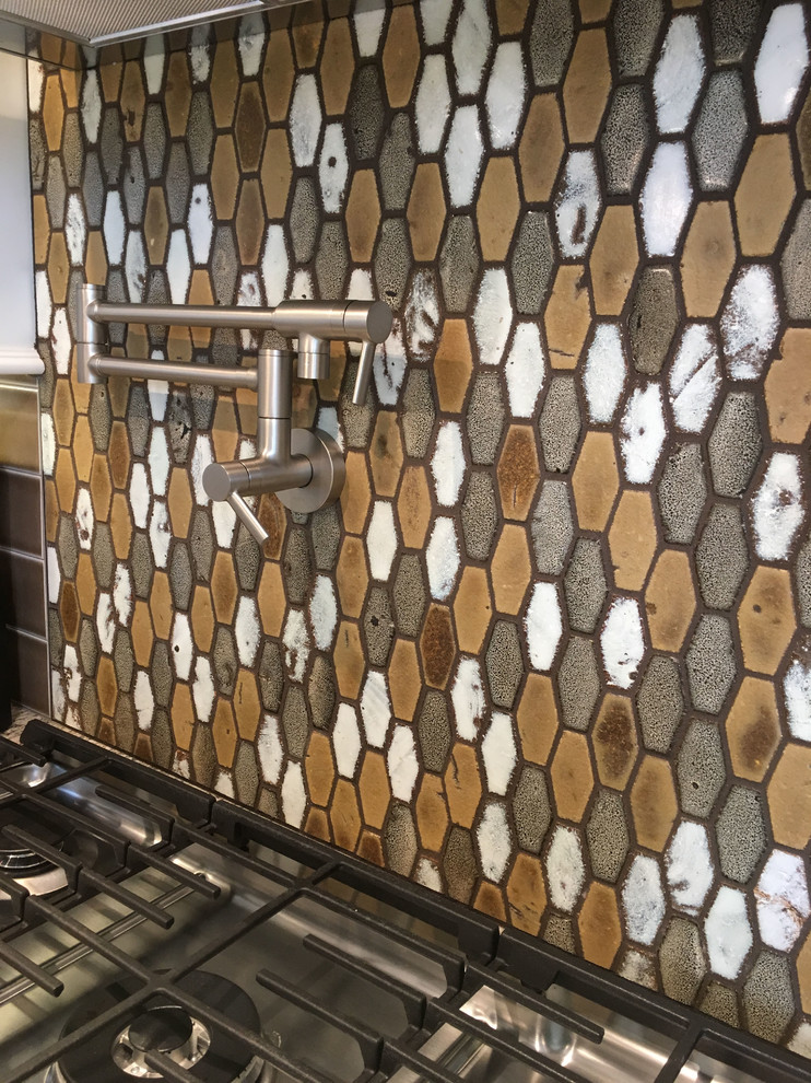 Example of a large transitional l-shaped vinyl floor and beige floor eat-in kitchen design with a double-bowl sink, recessed-panel cabinets, white cabinets, granite countertops, brown backsplash, ceramic backsplash, stainless steel appliances and an island