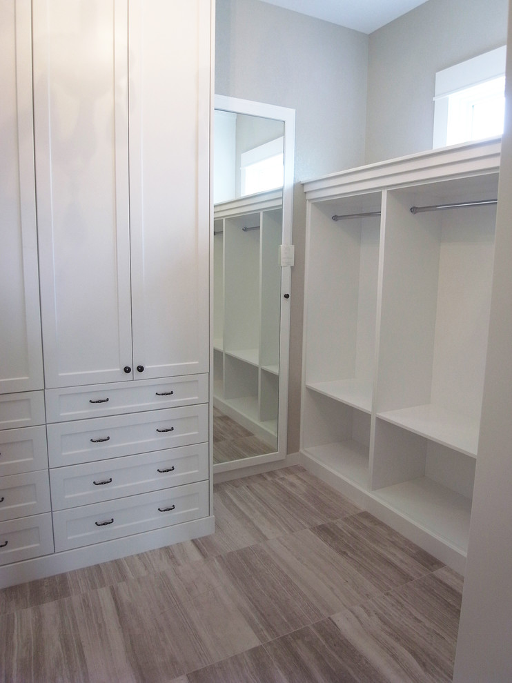 Walk-in closet - transitional women's walk-in closet idea with white cabinets and flat-panel cabinets