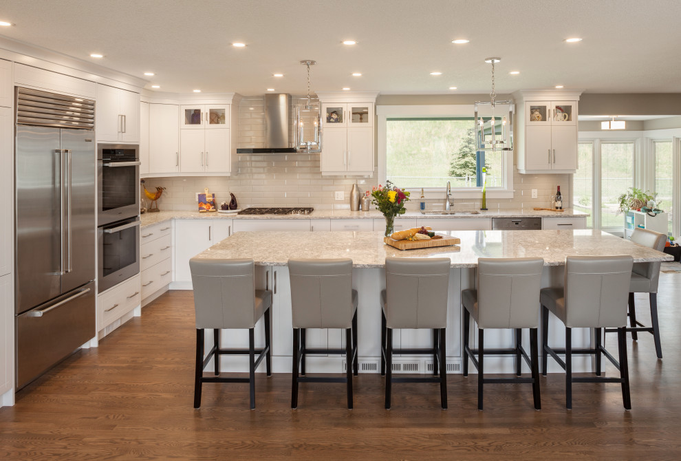 Example of a transitional kitchen design in Calgary