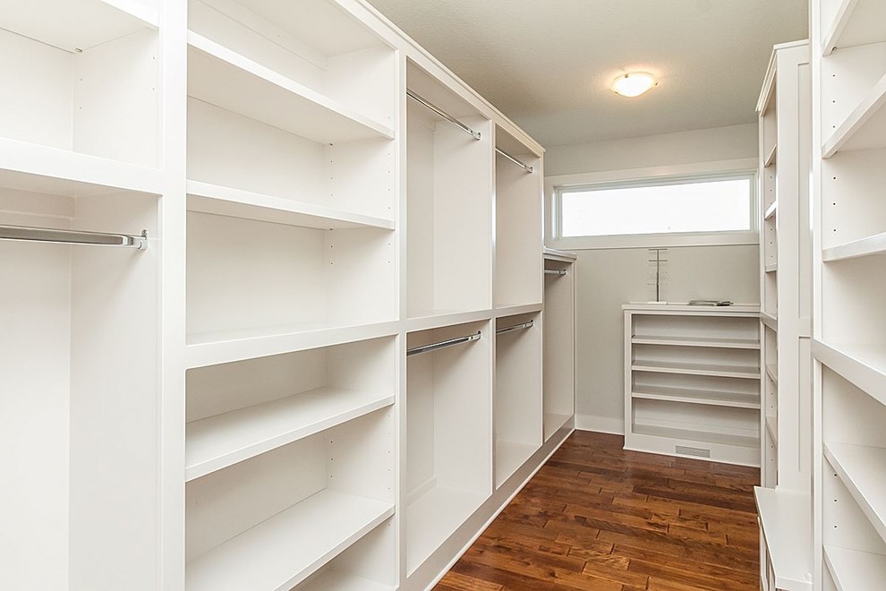 Walk-in closet - mid-sized transitional women's medium tone wood floor and brown floor walk-in closet idea with open cabinets and white cabinets