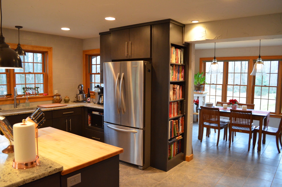 Transitional ceramic tile kitchen photo with an undermount sink, flat-panel cabinets, gray cabinets, quartz countertops, gray backsplash, ceramic backsplash, stainless steel appliances and an island
