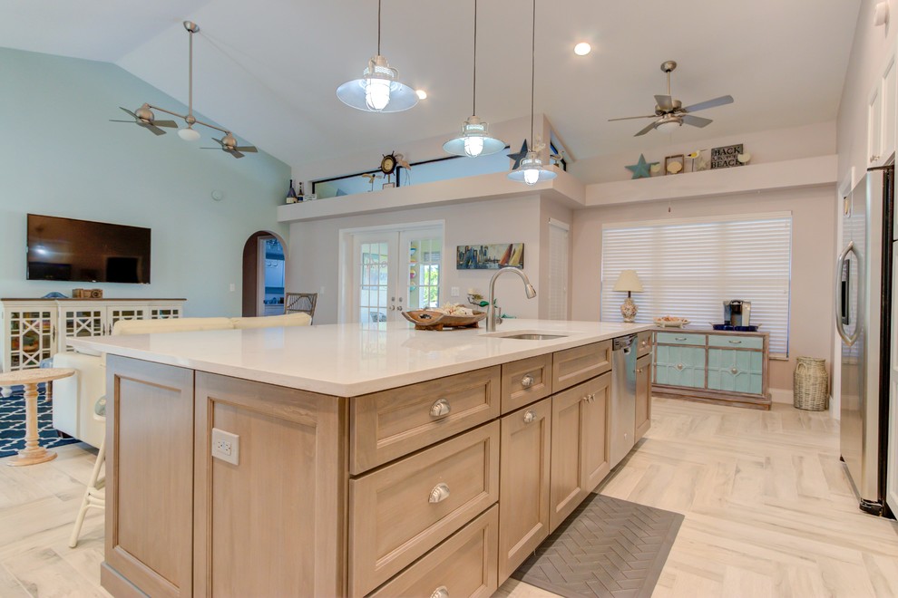 Inspiration for a large single-wall porcelain tile and white floor open concept kitchen remodel with an undermount sink, shaker cabinets, white cabinets, quartz countertops, blue backsplash, stainless steel appliances, an island and white countertops