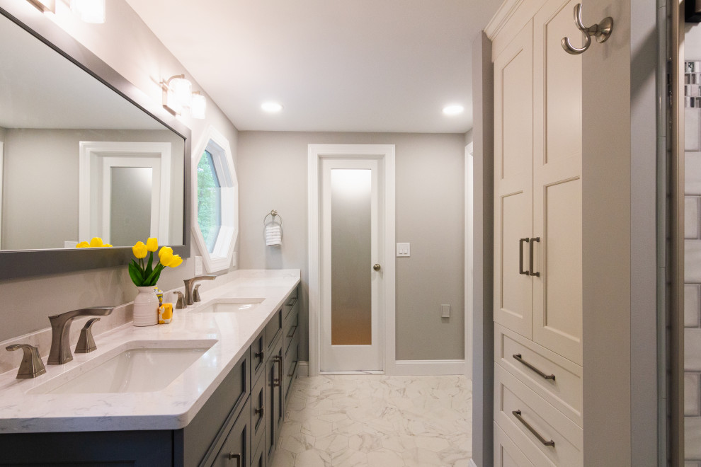 Mid-sized transitional master green tile and ceramic tile porcelain tile, white floor and double-sink sliding shower door photo with shaker cabinets, gray cabinets, a two-piece toilet, an undermount sink, quartz countertops, white countertops, a niche and a built-in vanity