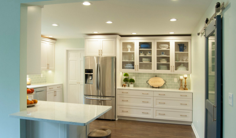 Eat-in kitchen - mid-sized transitional u-shaped dark wood floor eat-in kitchen idea in Chicago with a drop-in sink, raised-panel cabinets, white cabinets, granite countertops, green backsplash, subway tile backsplash, stainless steel appliances and an island