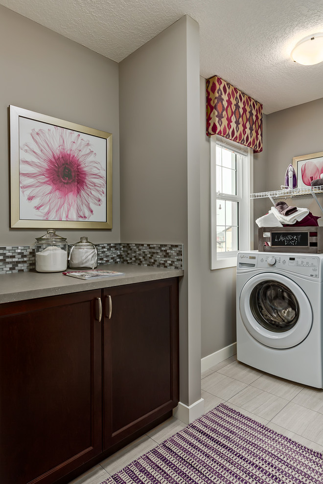 Transitional laundry room photo in Calgary