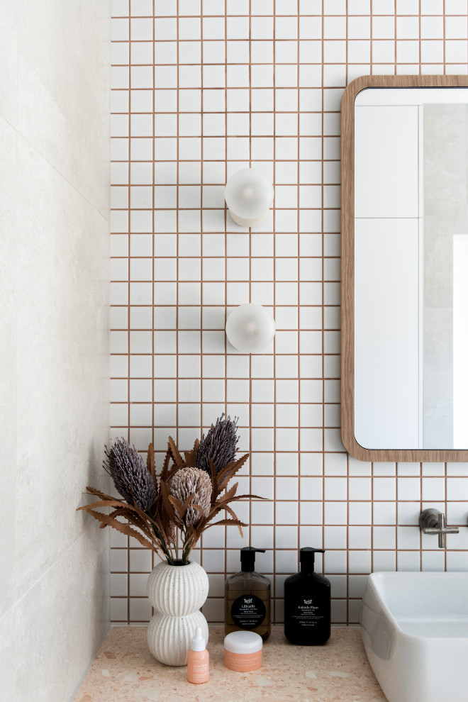 Inspiration for a mid-sized contemporary bathroom in Melbourne with medium wood cabinets, a corner tub, an open shower, white tile, terrazzo benchtops, an open shower, pink benchtops, an enclosed toilet, a single vanity and a floating vanity.
