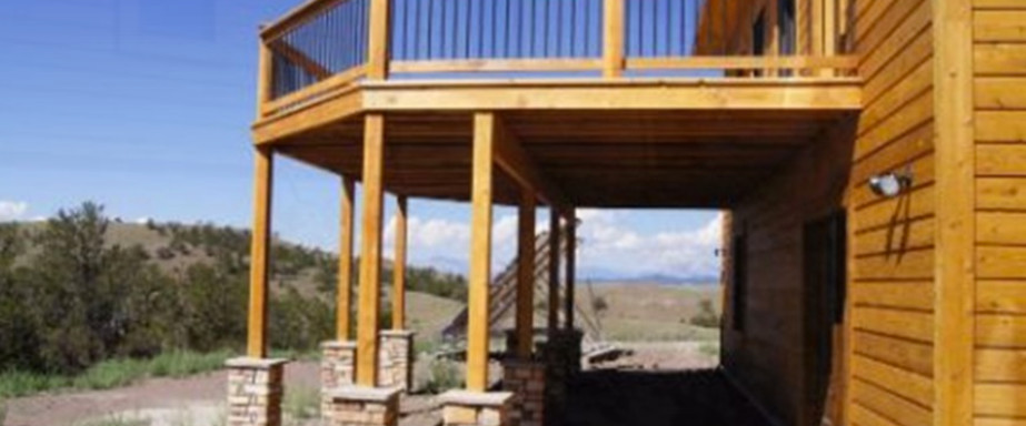 Inspiration for a large rustic one-story wood exterior home remodel in Denver