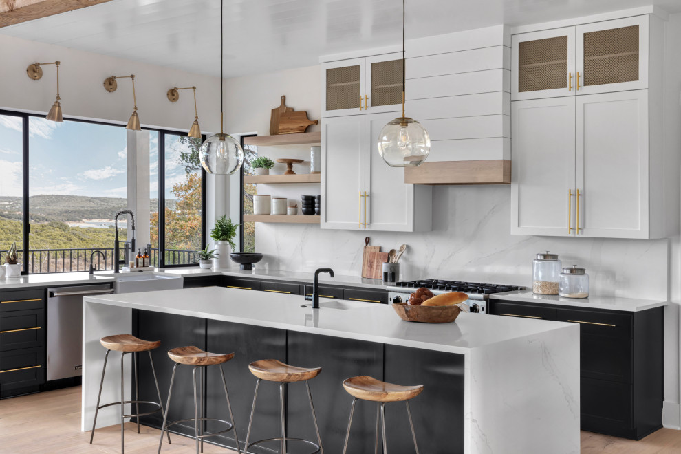 Eat-in kitchen - mid-sized cottage u-shaped light wood floor, brown floor and shiplap ceiling eat-in kitchen idea in Austin with a farmhouse sink, shaker cabinets, black cabinets, quartz countertops, white backsplash, quartz backsplash, stainless steel appliances, an island and white countertops