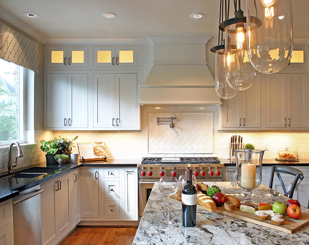 Kitchen - large transitional medium tone wood floor kitchen idea in Houston with an undermount sink, recessed-panel cabinets and an island