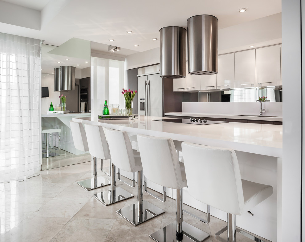 Inspiration for a large contemporary u-shaped open plan kitchen in Miami with a double-bowl sink, flat-panel cabinets, white cabinets, quartzite benchtops, white splashback, mirror splashback, stainless steel appliances, marble floors and with island.