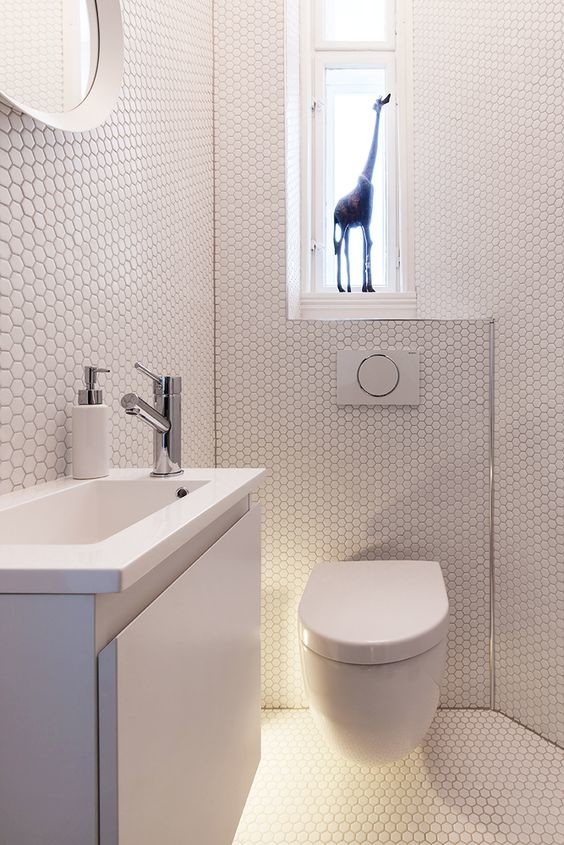 Design ideas for a small modern powder room in Miami with flat-panel cabinets, white cabinets, white tile, mosaic tile, white walls, mosaic tile floors, a wall-mount sink and white floor.