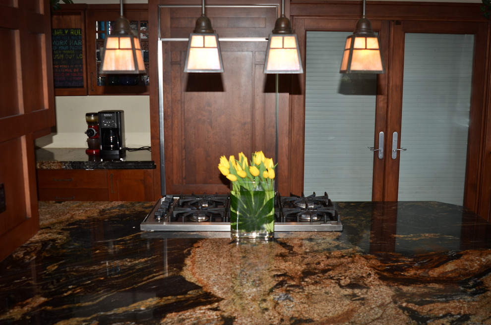 Eat-in kitchen - mid-sized transitional medium tone wood floor eat-in kitchen idea in Denver with an undermount sink, shaker cabinets, medium tone wood cabinets, granite countertops, stainless steel appliances and an island