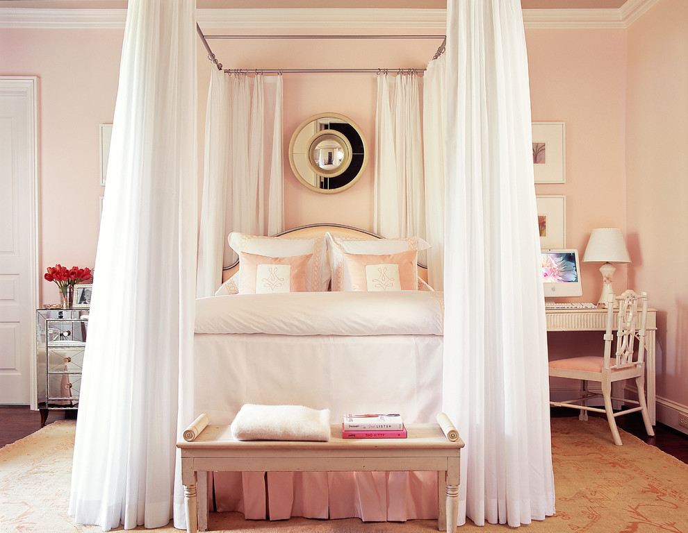 Photo of a large master bedroom in Atlanta with pink walls and dark hardwood floors.