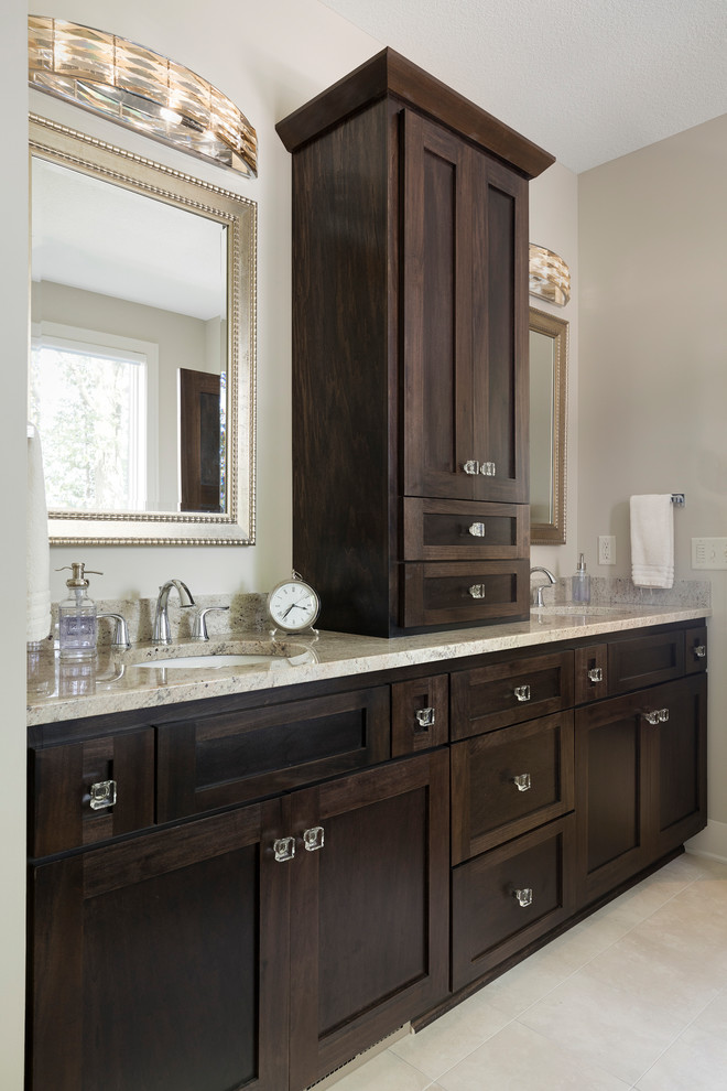 Inspiration for a large transitional master bathroom in Minneapolis with flat-panel cabinets, brown cabinets, beige walls, ceramic floors, an undermount sink, granite benchtops, beige floor and beige benchtops.