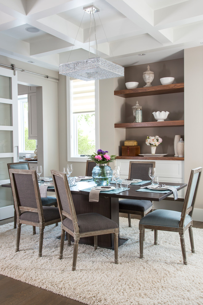Photo of a mid-sized transitional separate dining room in Calgary with beige walls and vinyl floors.