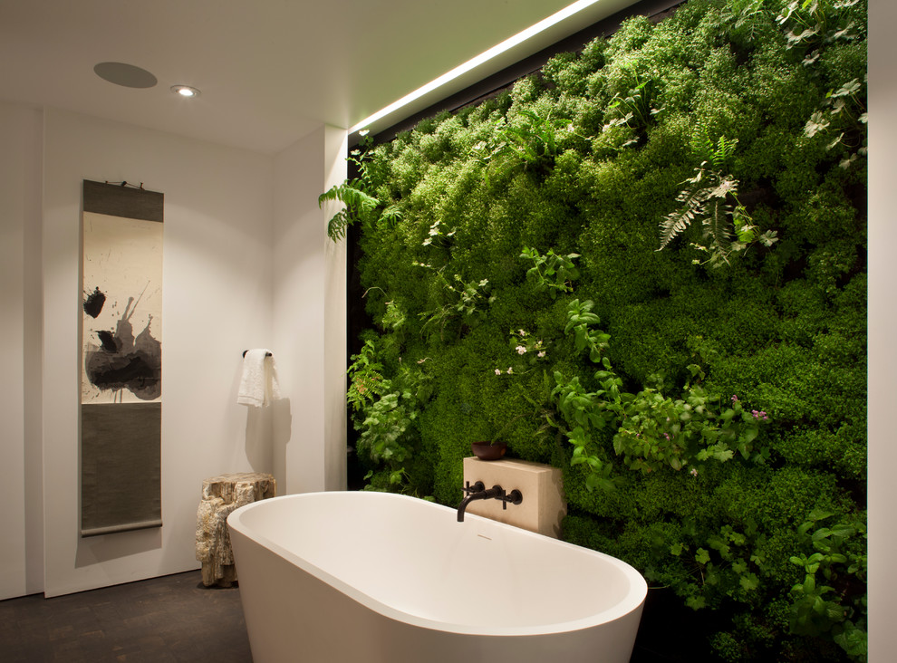 Contemporary bathroom in San Francisco with a freestanding tub and green walls.