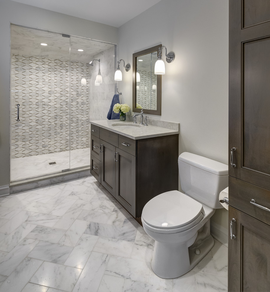 Design ideas for a mid-sized transitional 3/4 bathroom in Chicago with recessed-panel cabinets, dark wood cabinets, an alcove shower, a two-piece toilet, grey walls, an undermount sink, quartzite benchtops, white floor, a hinged shower door and beige benchtops.