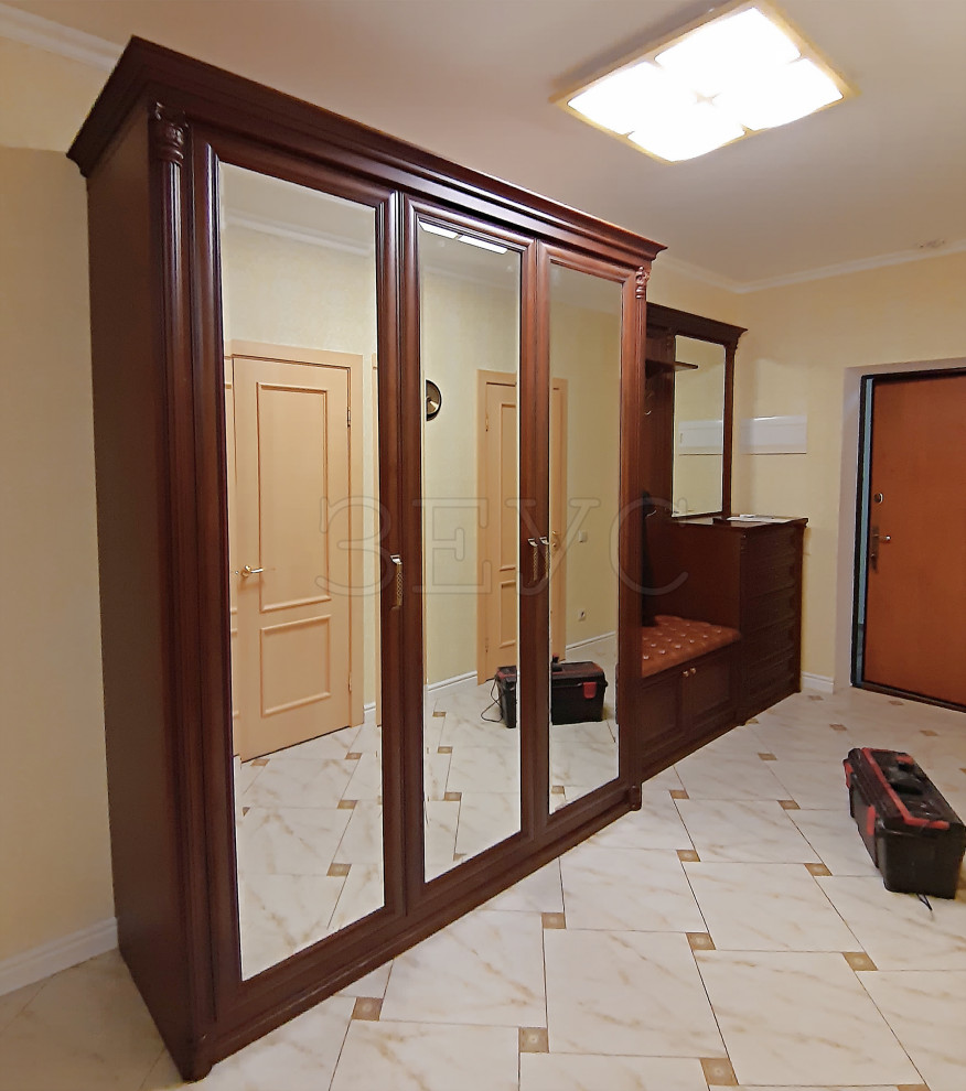 Large elegant ceramic tile and white floor entryway photo in Moscow with beige walls and a glass front door