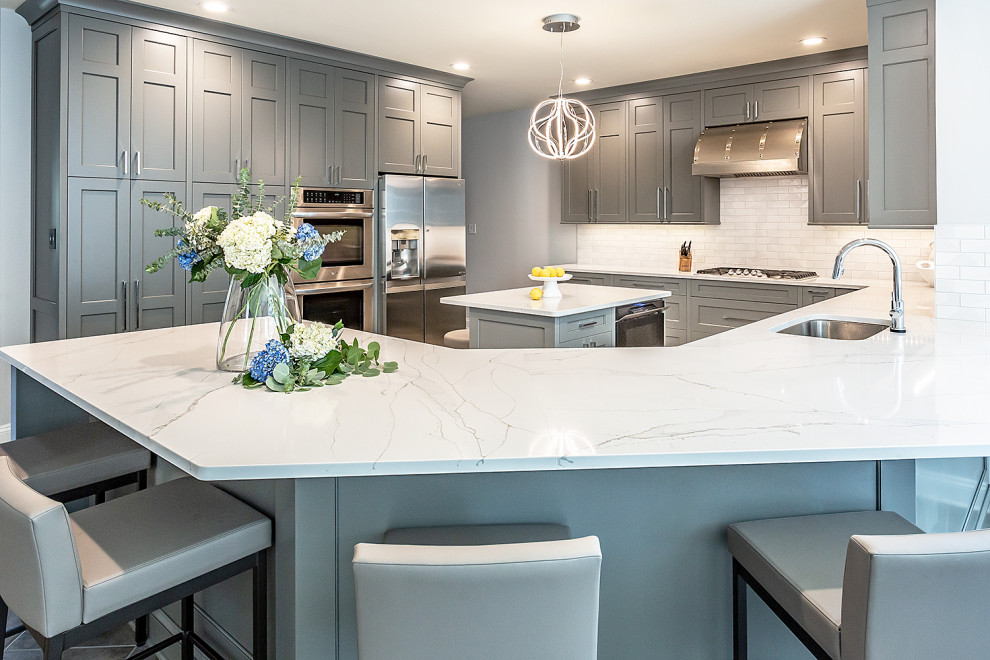 Example of a large transitional u-shaped ceramic tile and gray floor eat-in kitchen design in Richmond with an undermount sink, gray cabinets, granite countertops, red backsplash, stainless steel appliances, an island and white countertops
