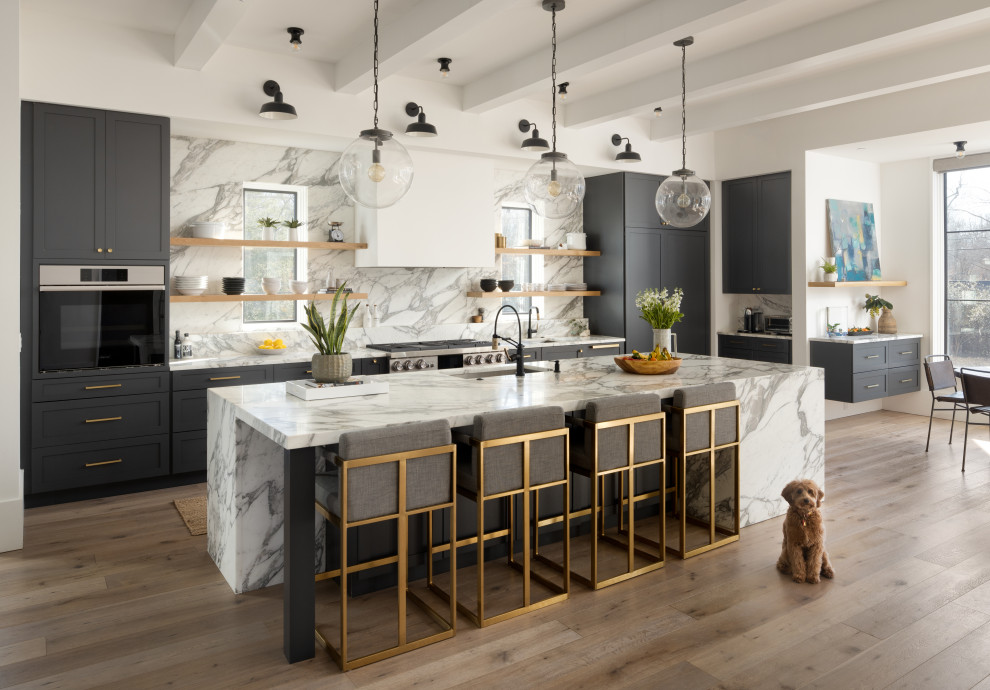 Photo of a transitional galley eat-in kitchen in DC Metro with an undermount sink, shaker cabinets, grey cabinets, multi-coloured splashback, panelled appliances, medium hardwood floors, with island, brown floor and multi-coloured benchtop.