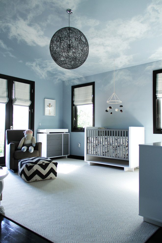 Design ideas for a mid-sized contemporary gender-neutral nursery in Los Angeles with blue walls.