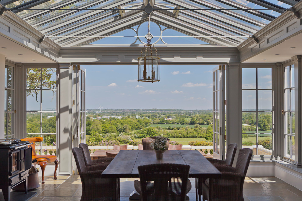 This is an example of a large traditional sunroom in London.