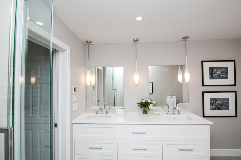 Inspiration for a small contemporary master bathroom in Ottawa with shaker cabinets, white cabinets, a freestanding tub, an alcove shower, white tile, porcelain tile, grey walls, an undermount sink, engineered quartz benchtops, a two-piece toilet, ceramic floors, grey floor and a hinged shower door.