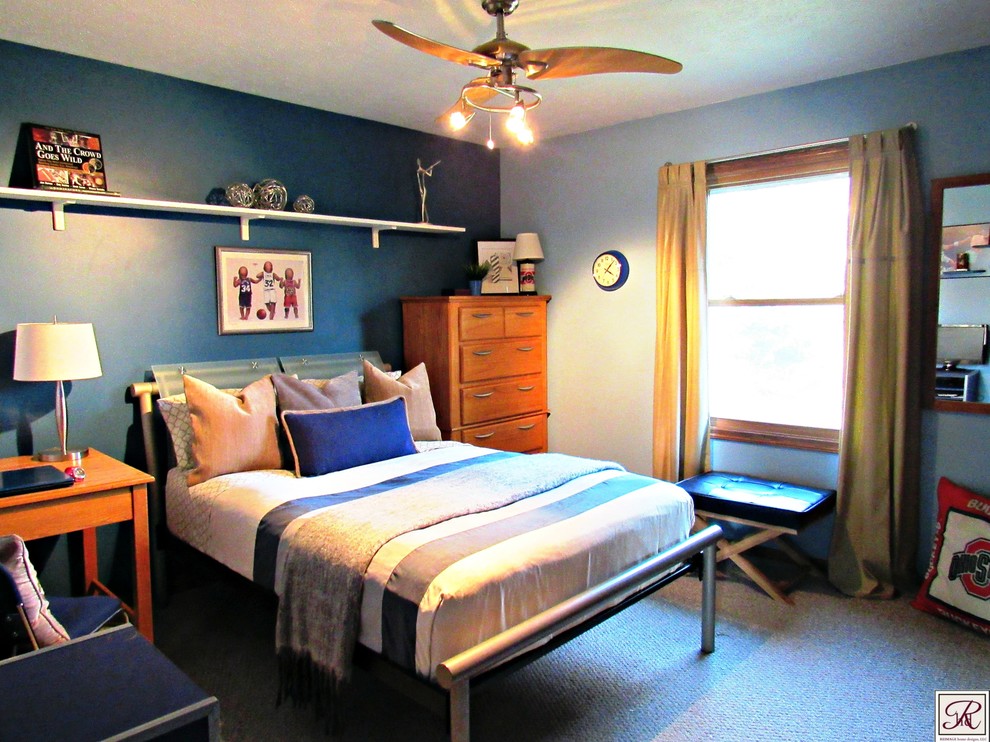 This is an example of a transitional bedroom in Cleveland with blue walls.