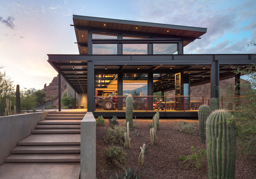Contemporary two-storey grey house exterior in Phoenix with a flat roof.