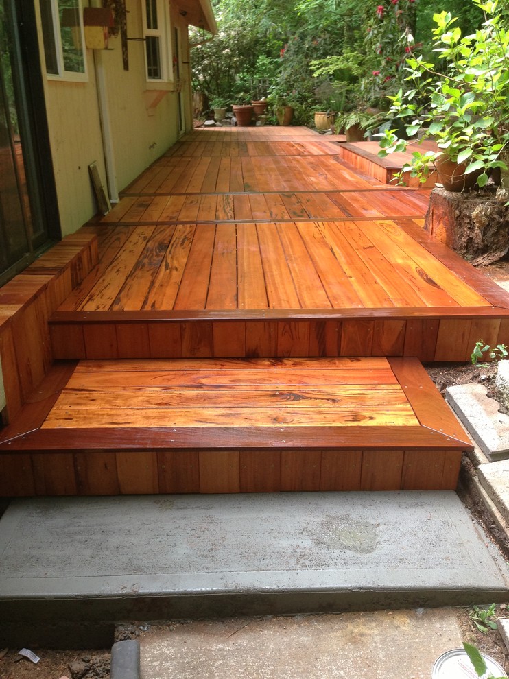 Photo of a large arts and crafts backyard deck in Portland.