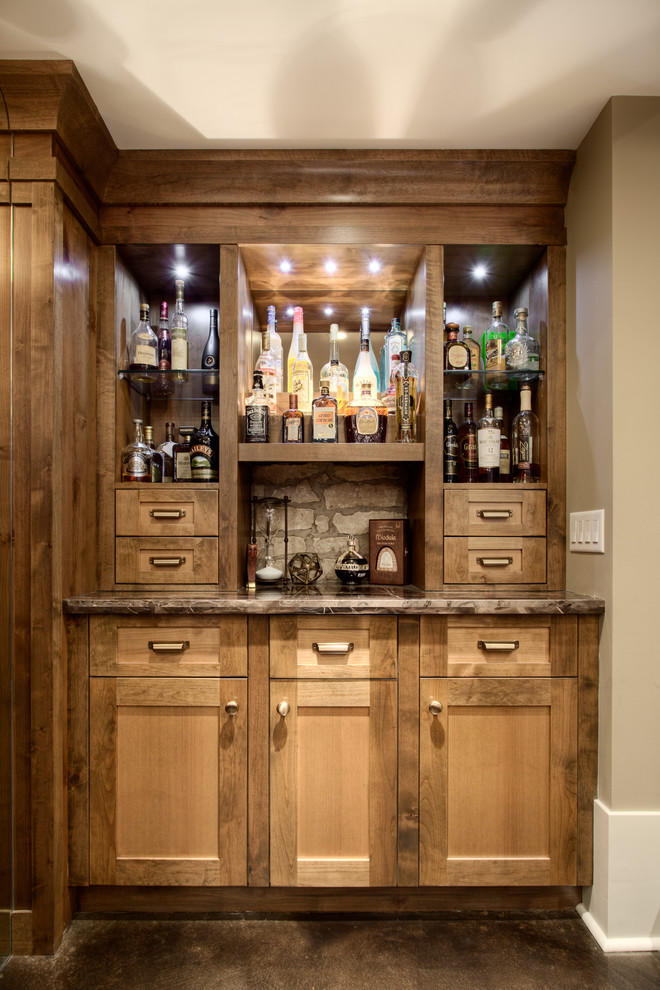 Mid-sized transitional home bar in Calgary with concrete floors.