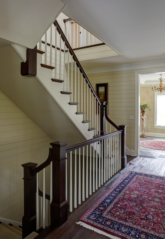 Design ideas for a large traditional wood curved staircase in Other with wood risers and wood railing.