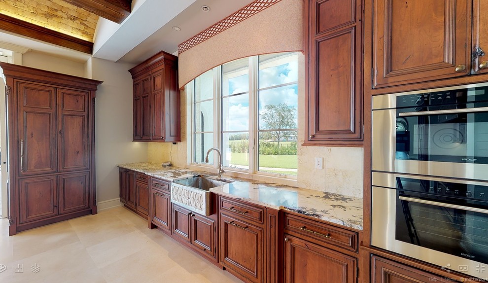 Inspiration for a huge rustic travertine floor and beige floor eat-in kitchen remodel in Miami with an undermount sink, beaded inset cabinets, dark wood cabinets, granite countertops, beige backsplash, stone slab backsplash, paneled appliances, an island and multicolored countertops