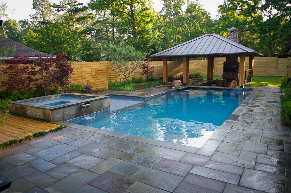 Inspiration for a mid-sized contemporary backyard rectangular lap pool in New Orleans with a hot tub and concrete pavers.