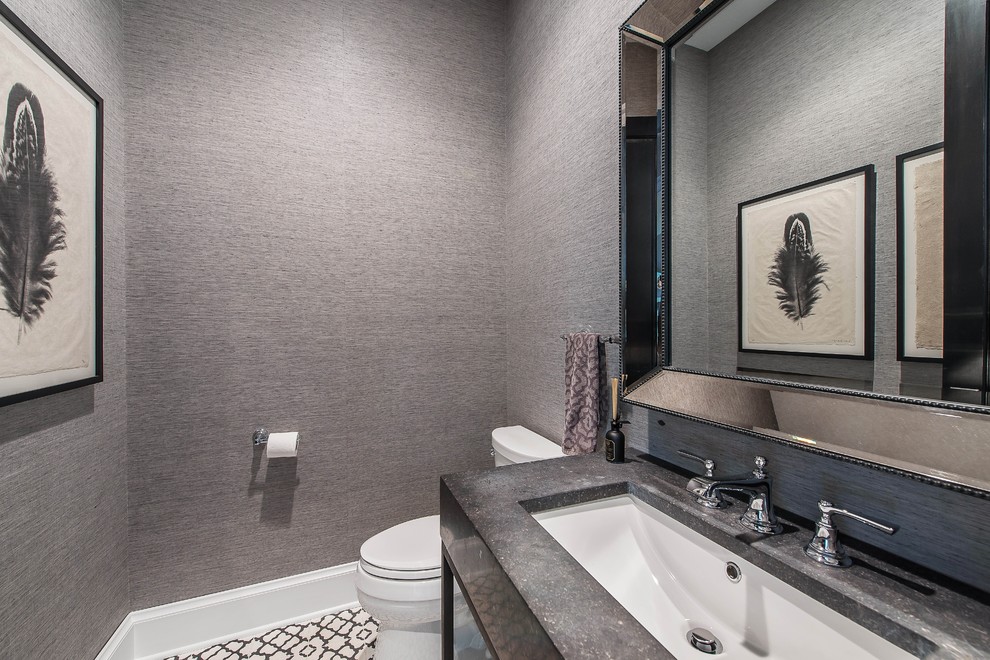 This is an example of a mid-sized country powder room in Chicago with open cabinets, black cabinets, a two-piece toilet, grey walls, ceramic floors, an undermount sink, granite benchtops and multi-coloured floor.