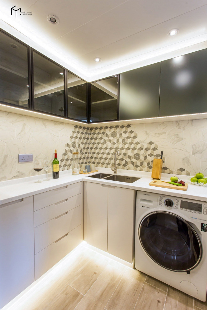 Small contemporary galley separate kitchen in Hong Kong.