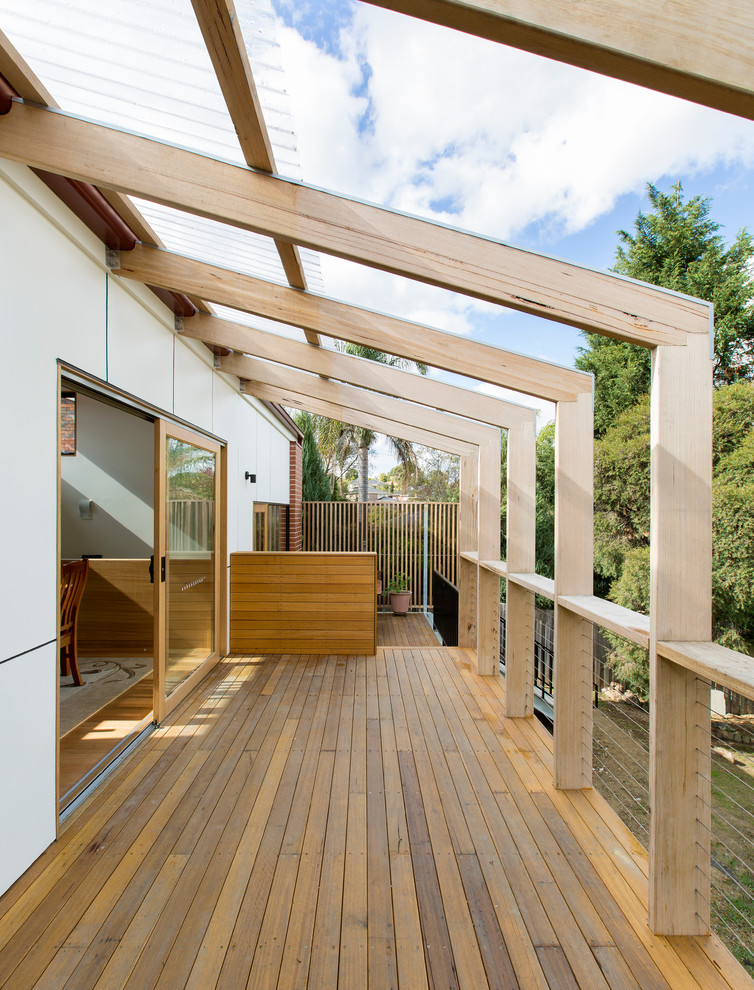 This is an example of a small contemporary deck in Melbourne with a pergola.