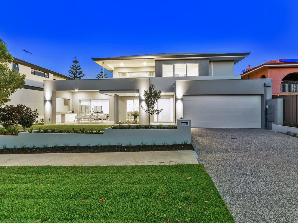Large contemporary two-storey stucco grey house exterior in Perth with a hip roof and a metal roof.