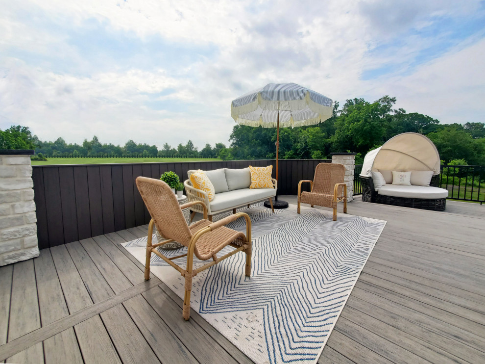 Deck - mid-sized modern backyard second story metal railing deck idea in Other with a fire pit